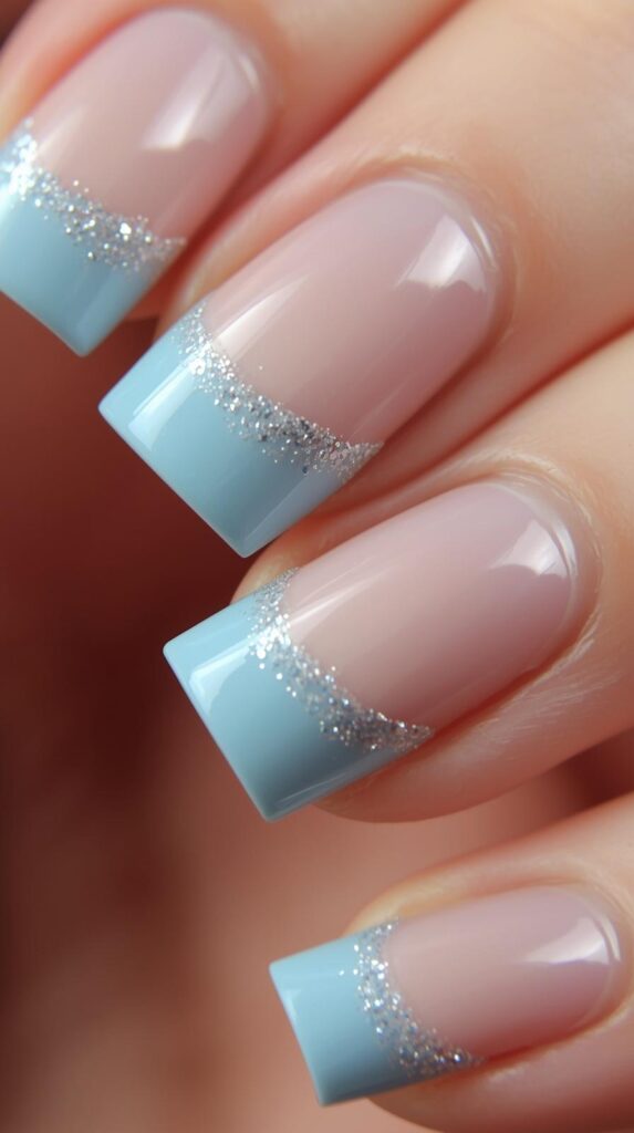 10. Icy Blue French Tips with Glitter Outline