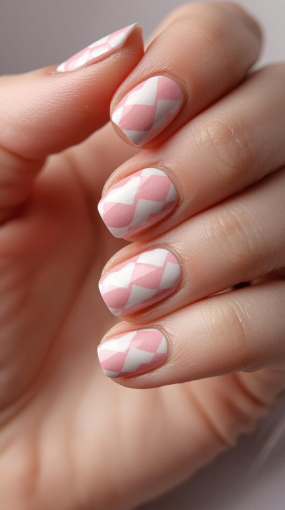 1. Classic Pink and White Argyle Nails