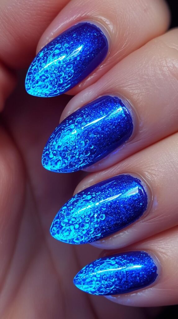 11. Electric Blue Aura Almond Nails