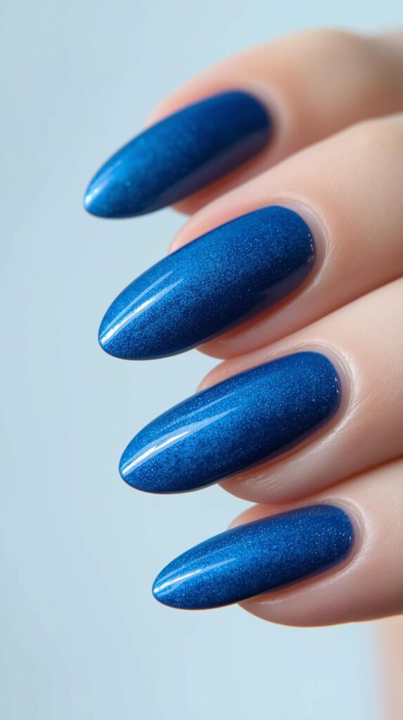 5. Ocean Blue Aura Almond Nails