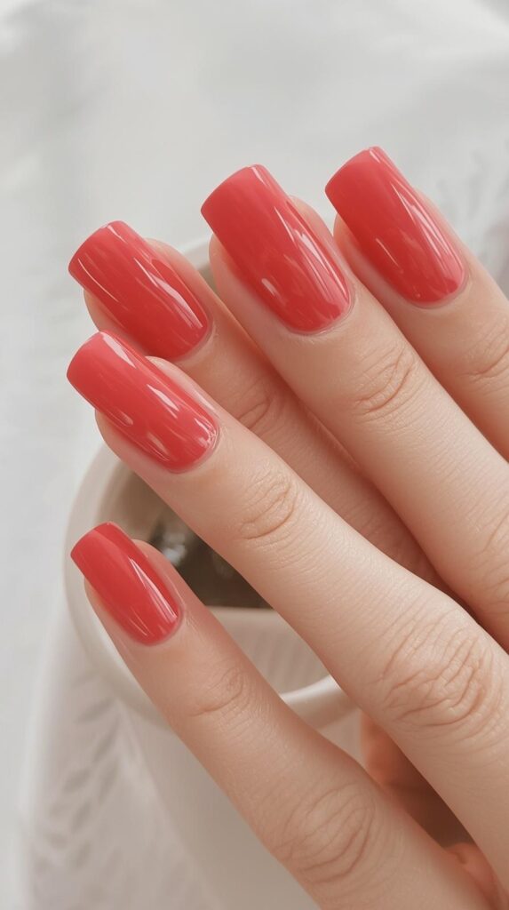 6. Bright Coral Nails