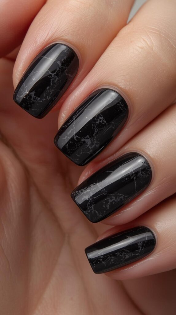 7. Black Marble Nails