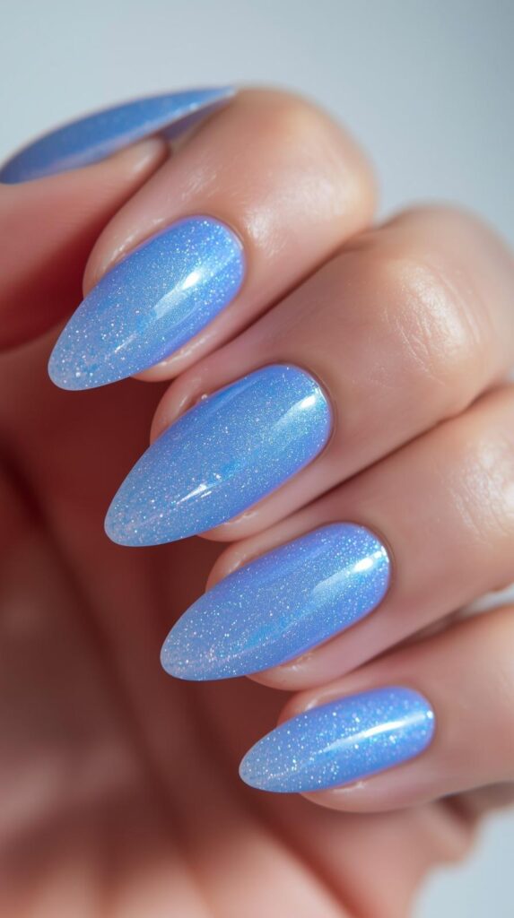 8. Icy Blue Aura Almond Nails