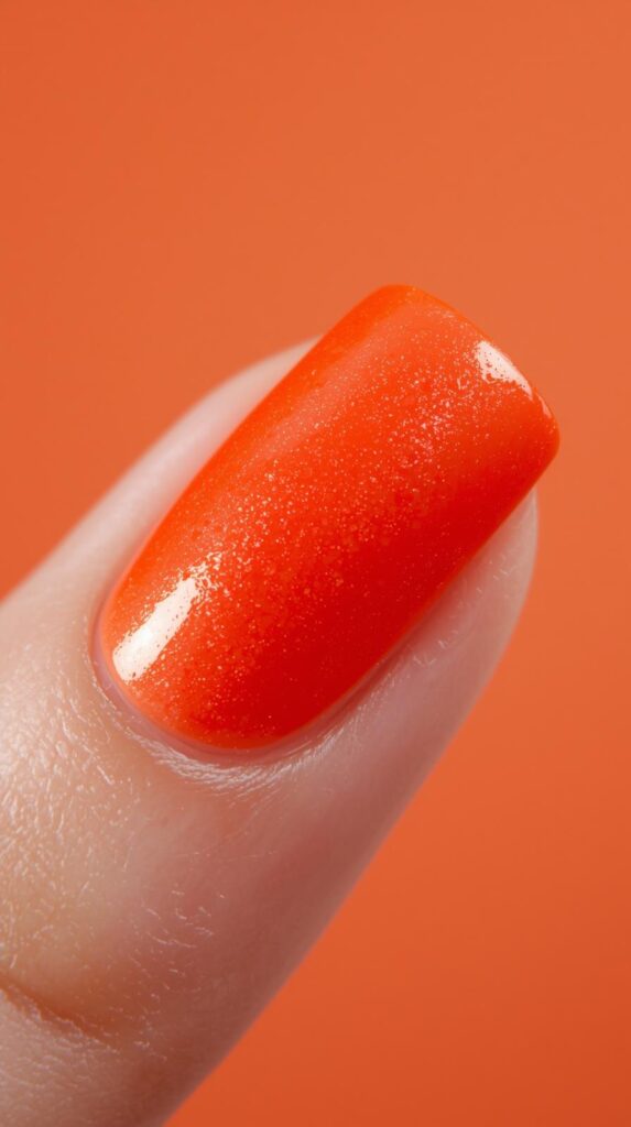 8. Hot Orange Glow Nail